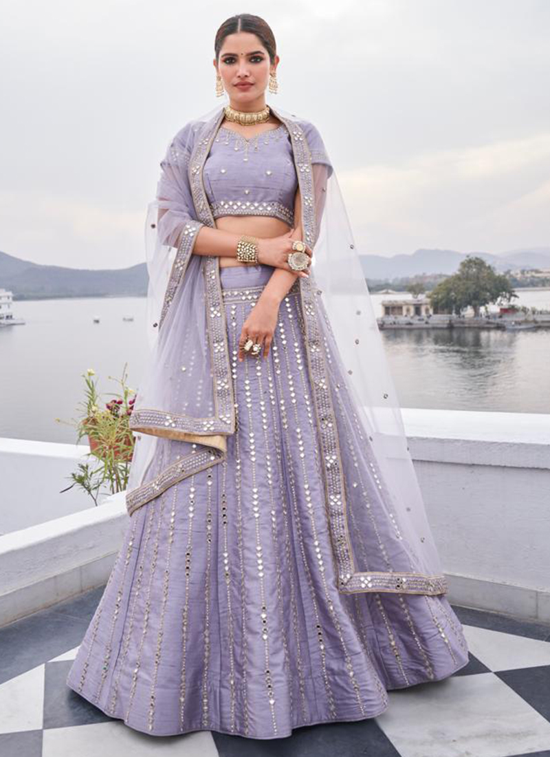 Photo of Candid shot of a bride dressed in a heavy lehenga.