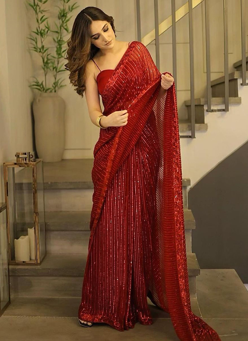 Deep red georgette saree with stone work and and pearl edging – House of  Blouse | Georgette sarees, Saree, Stylish sarees