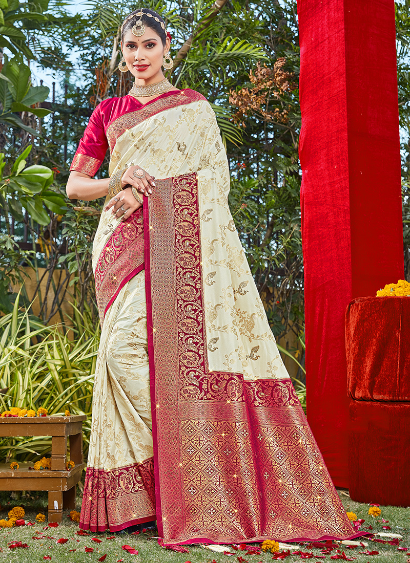 Cream embroidered fancy raw-silk designer saree with unique buttas,  contrast patch-work border & intricate chevron pallu