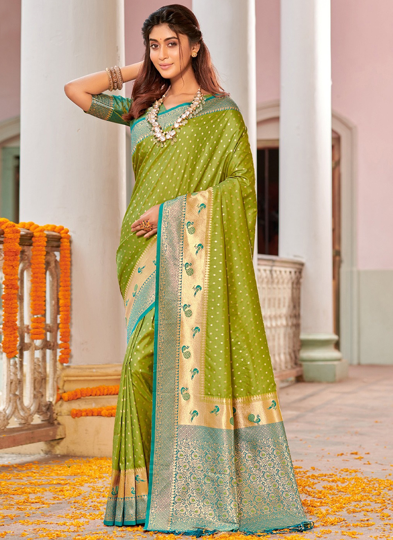 Parrot green color organza silk saree with zari weaving work