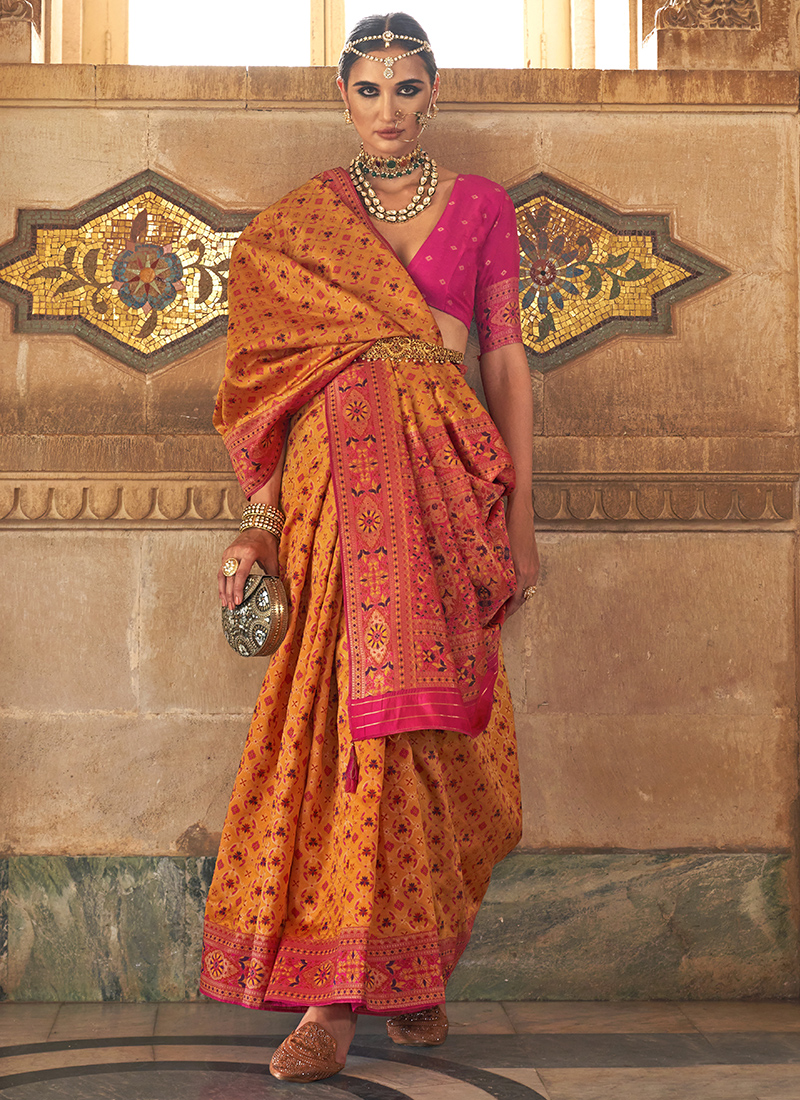 Orange embossed silk saree with double korvai borders in floral design &  pallu featuring lots of tiny flowers in zari